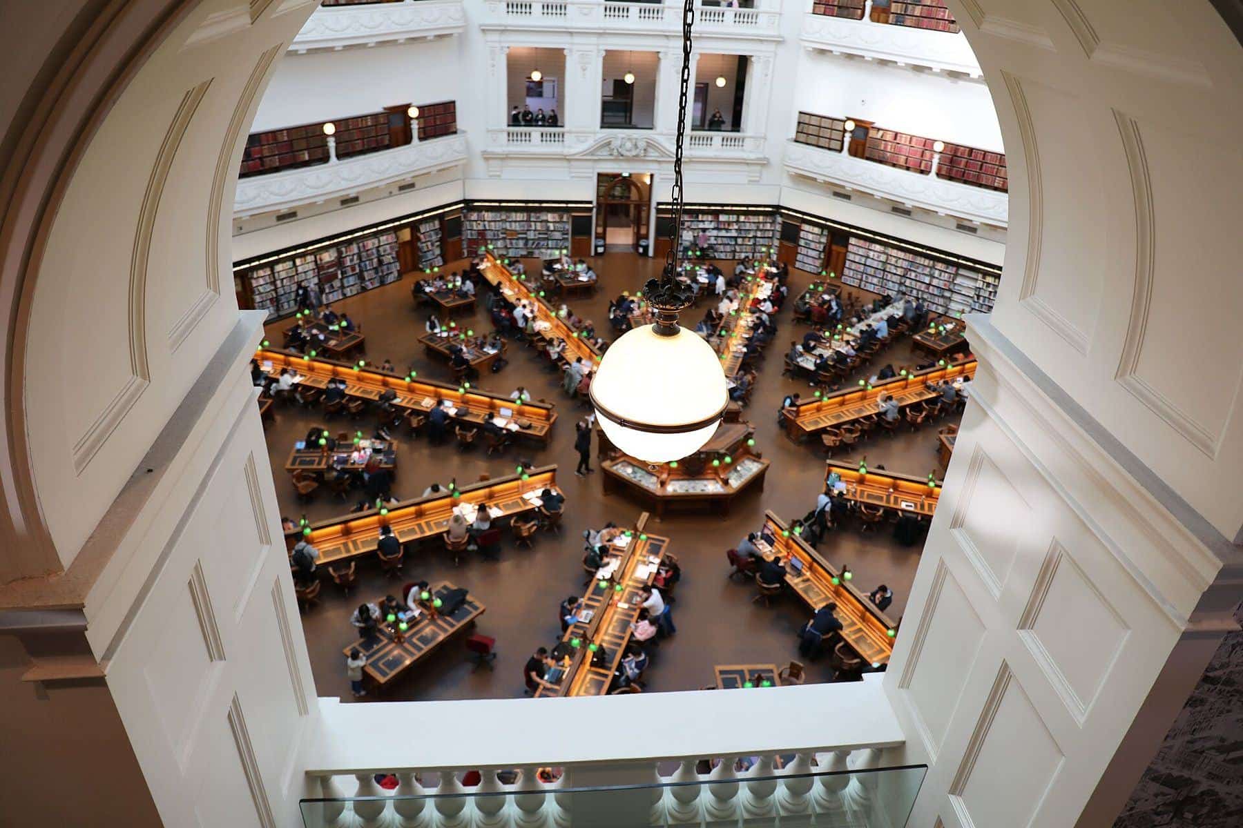 The domed La Trobe Reading Room at the State Library Victoria seen through an archway